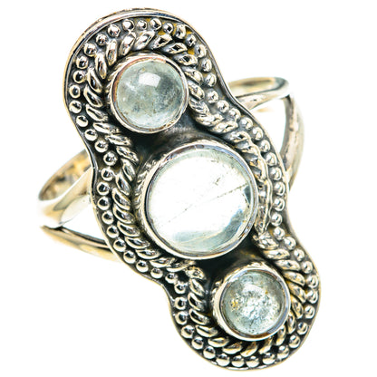 Sterling silver aquamarine ring, oval band with three round bezel-set stones, side view