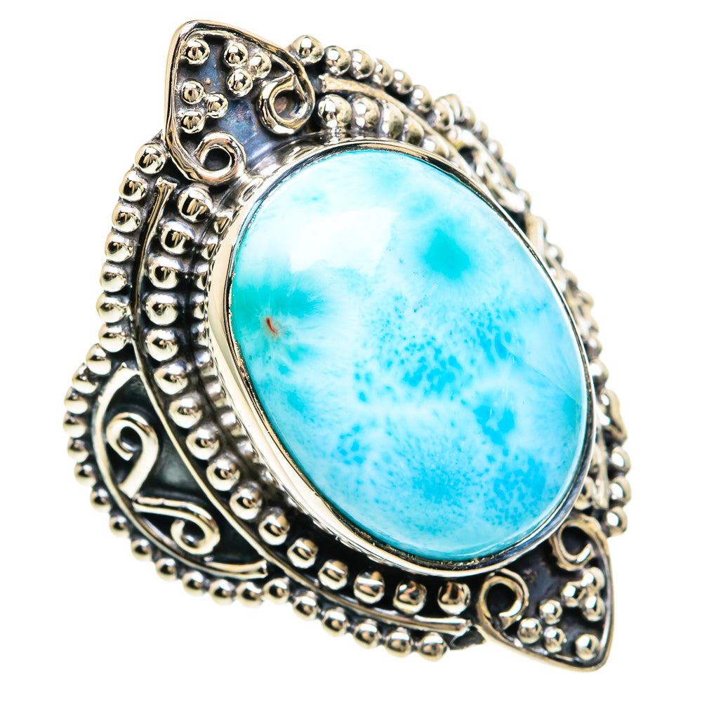 Oval blue larimar cabochon ring with decorative sterling-silver filigree setting.