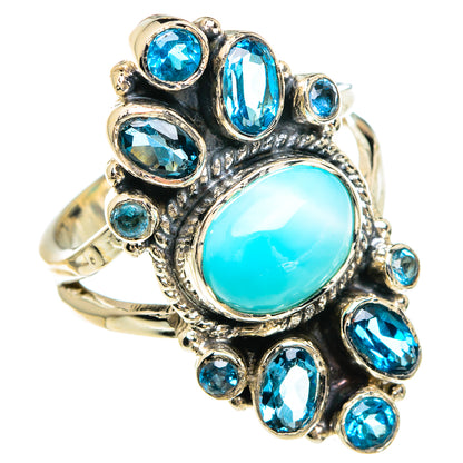 Turquoise oval gemstone ring with blue stones and ornate sterling silver setting