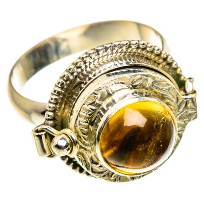 Sterling silver citrine ring with oval yellow stone, raised bezel, and engraved beadwork