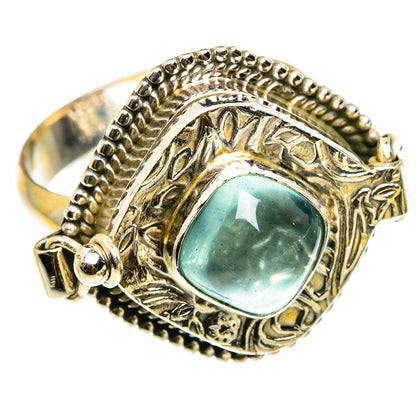 Large sterling silver poison ring with oval aquamarine cabochon and ornate engraved bezel