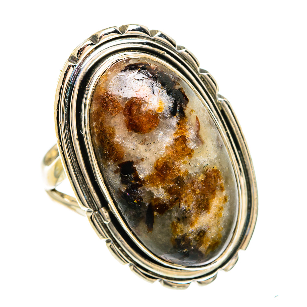Russian eudialyte oval ring in sterling silver with layered bezel and dark, amber stone