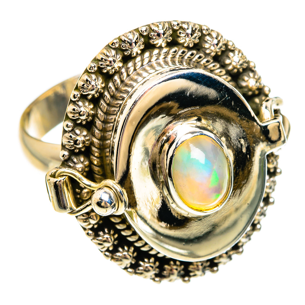 Large oval opal ring with textured halo, silver-tone bezel and prong-set accents