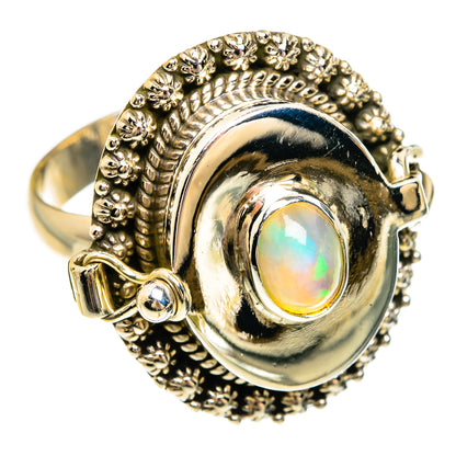 Large oval opal ring with textured halo, silver-tone bezel and prong-set accents