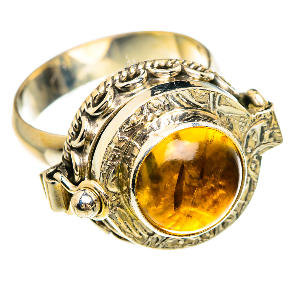 Sterling silver ring with oval amber citrine cabochon and ornate engraved band