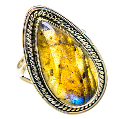 Sterling silver labradorite oval ring with yellow-gold gemstone and blue flash