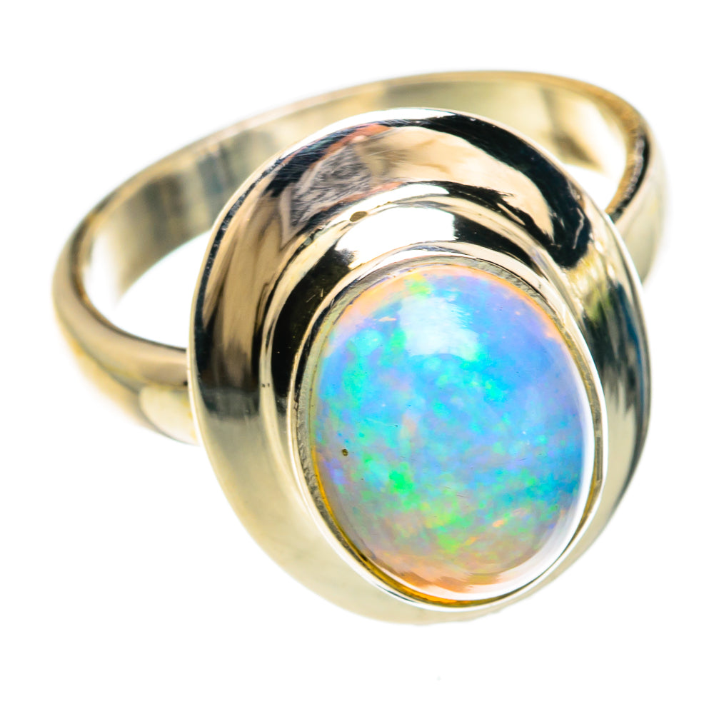 Opal cabochon ring with curved bezel, reflective metal band