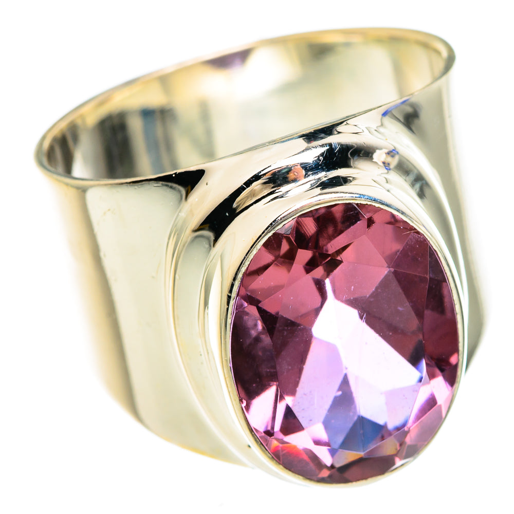 Sterling silver ring with oval purple faceted gemstone in curved bezel