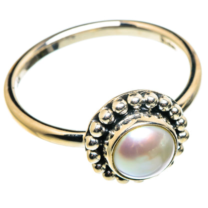 Cultured pearl ring with round iridescent pearl and bead halo on polished metal band