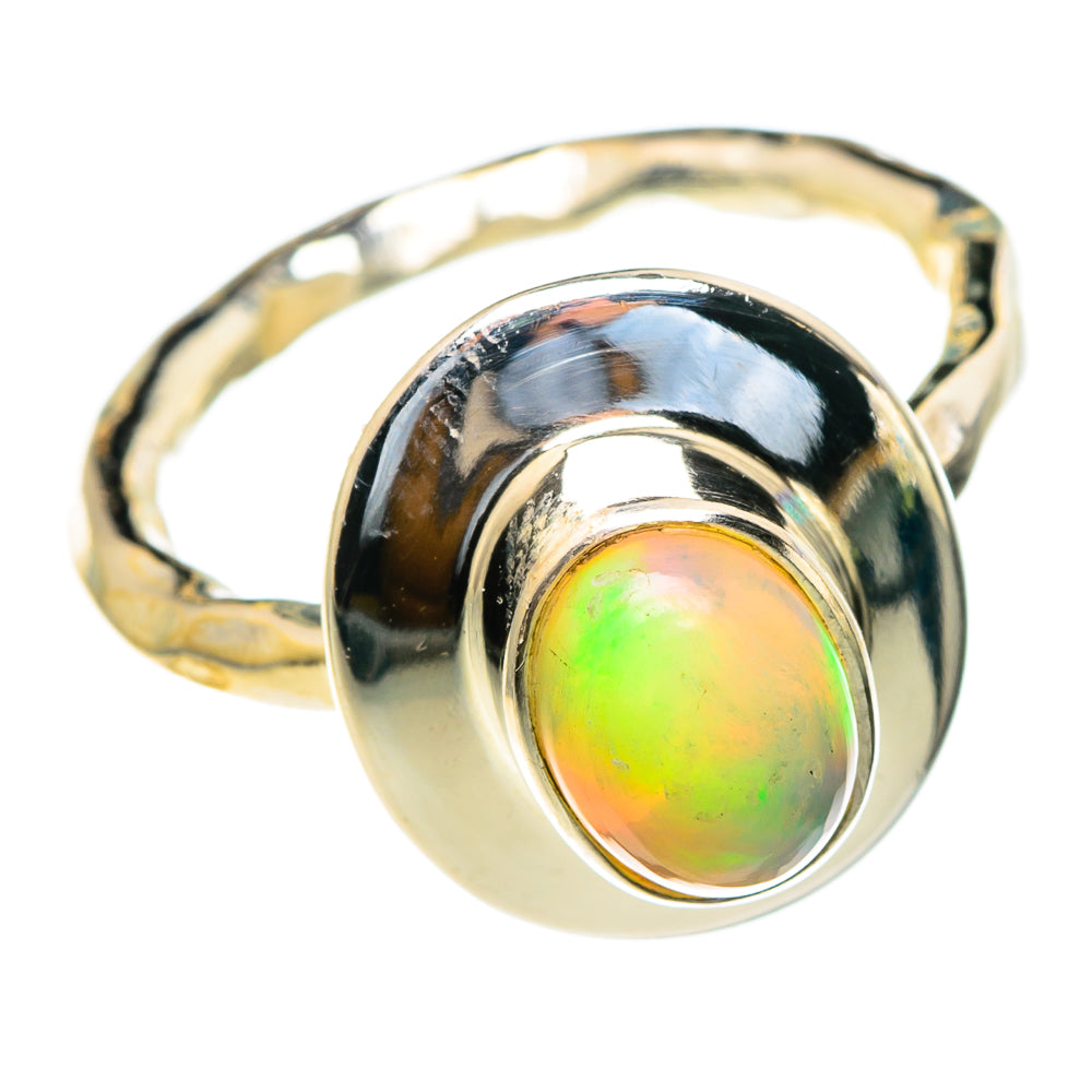 Sterling silver opal ring with round iridescent green-orange gemstone, polished band