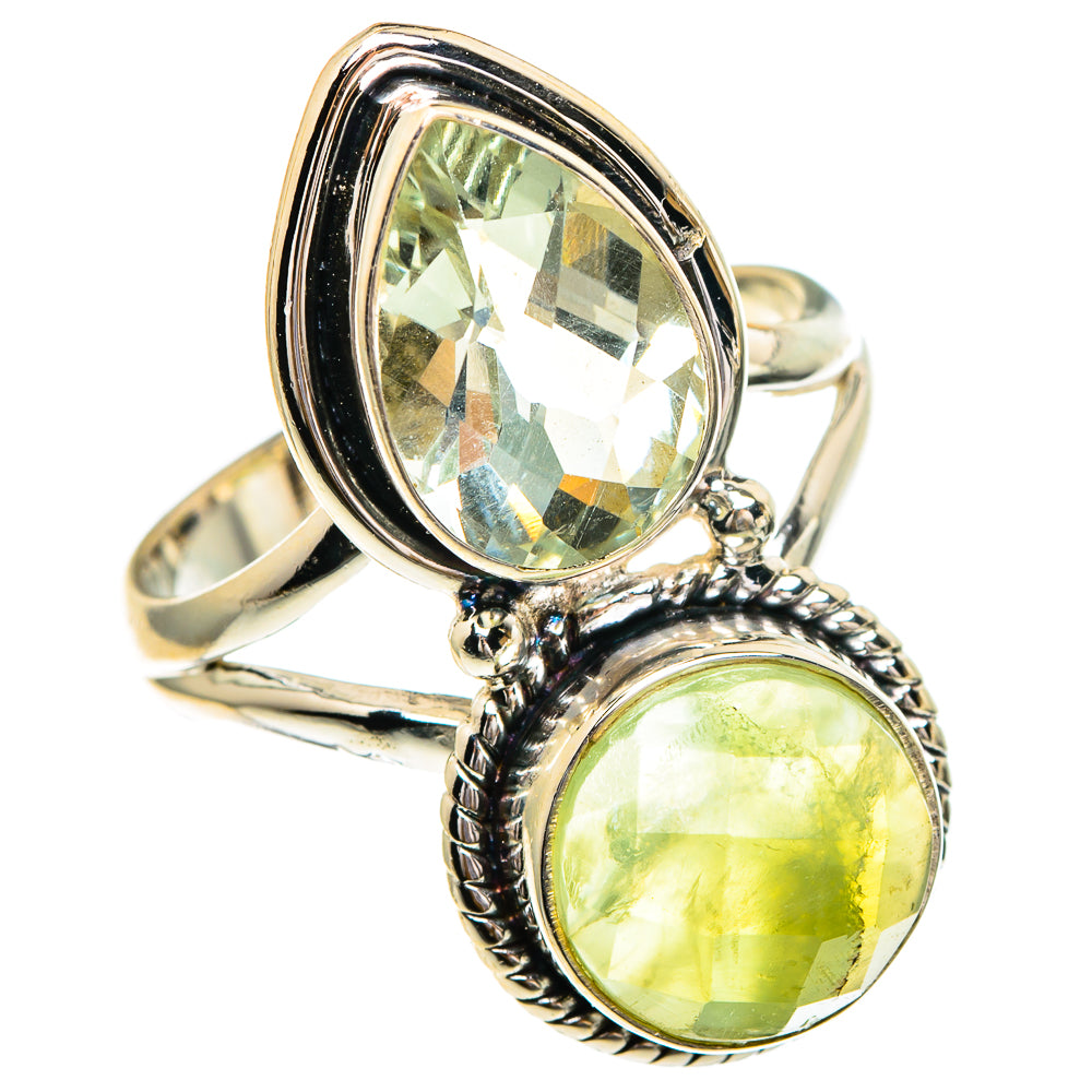 Sterling silver ring with two oval green gemstones in raised bezels