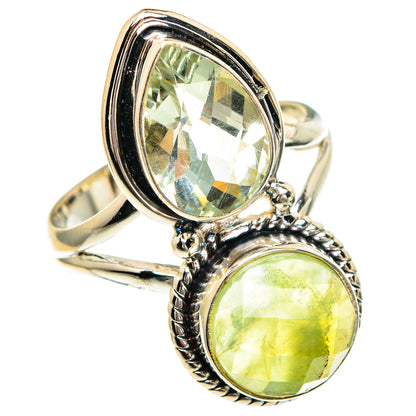 Sterling silver ring with two oval green gemstones in raised bezels