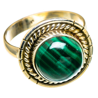 Malachite cabochon ring with oval green stone, braided-style bezel, and band