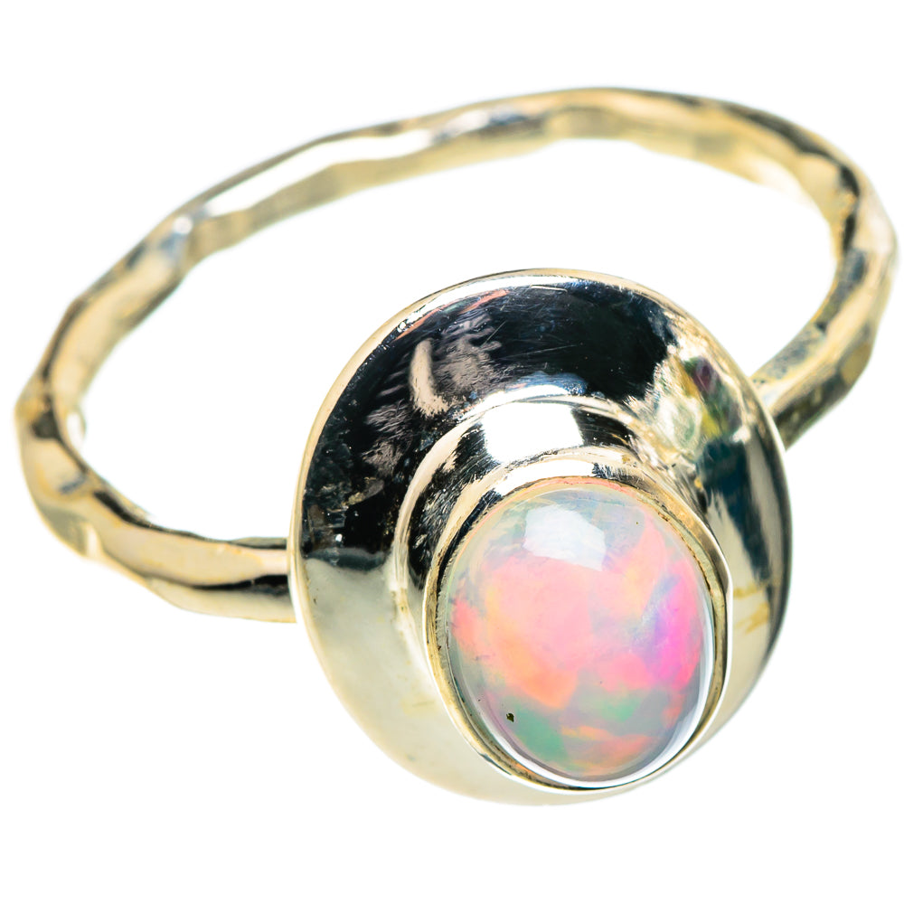 Sterling silver opal ring with oval iridescent stone in bezel setting