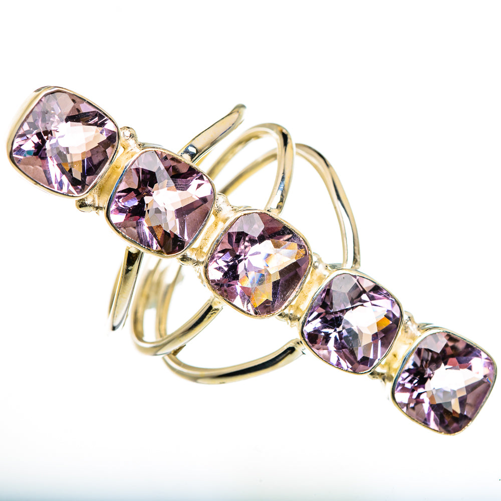 Faceted kunzite ring with oval purple gemstones in gold-tone prongs