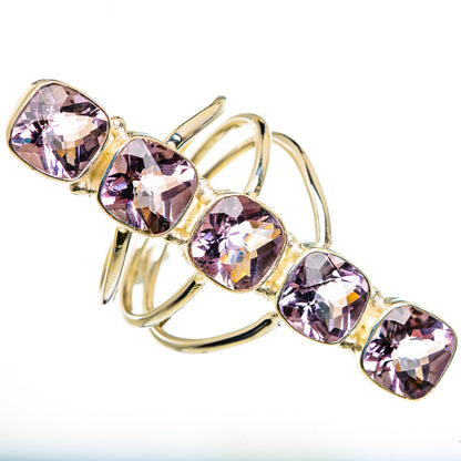 Faceted kunzite ring with oval purple gemstones in gold-tone prongs