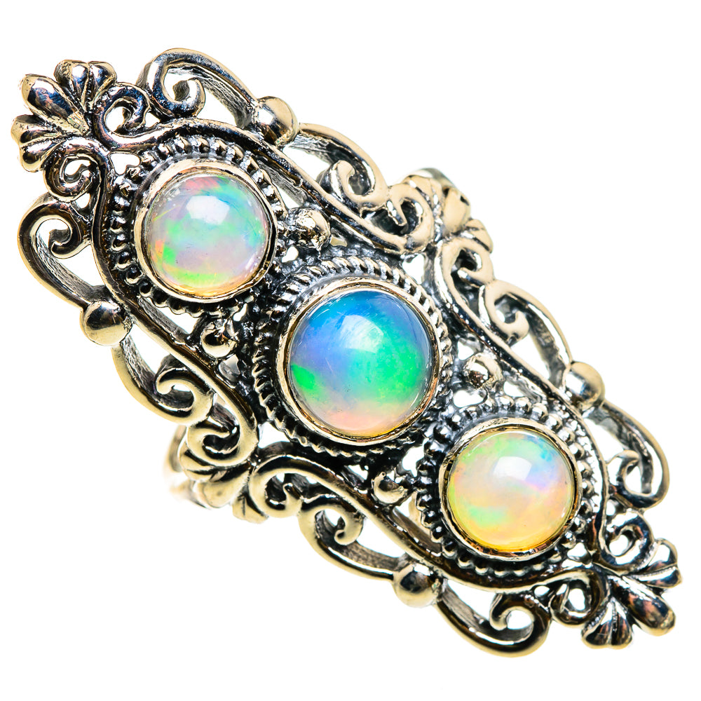 Sterling silver opal ring with three oval iridescent Ethiopian opal cabochons, ornate bezel