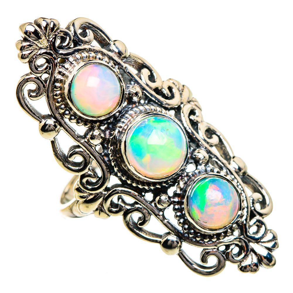 Sterling silver opal ring with three iridescent oval stones and vintage scrollwork detail
