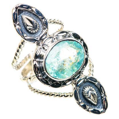 Sterling silver ring with round blue-green gemstone and braided rope-like band details
