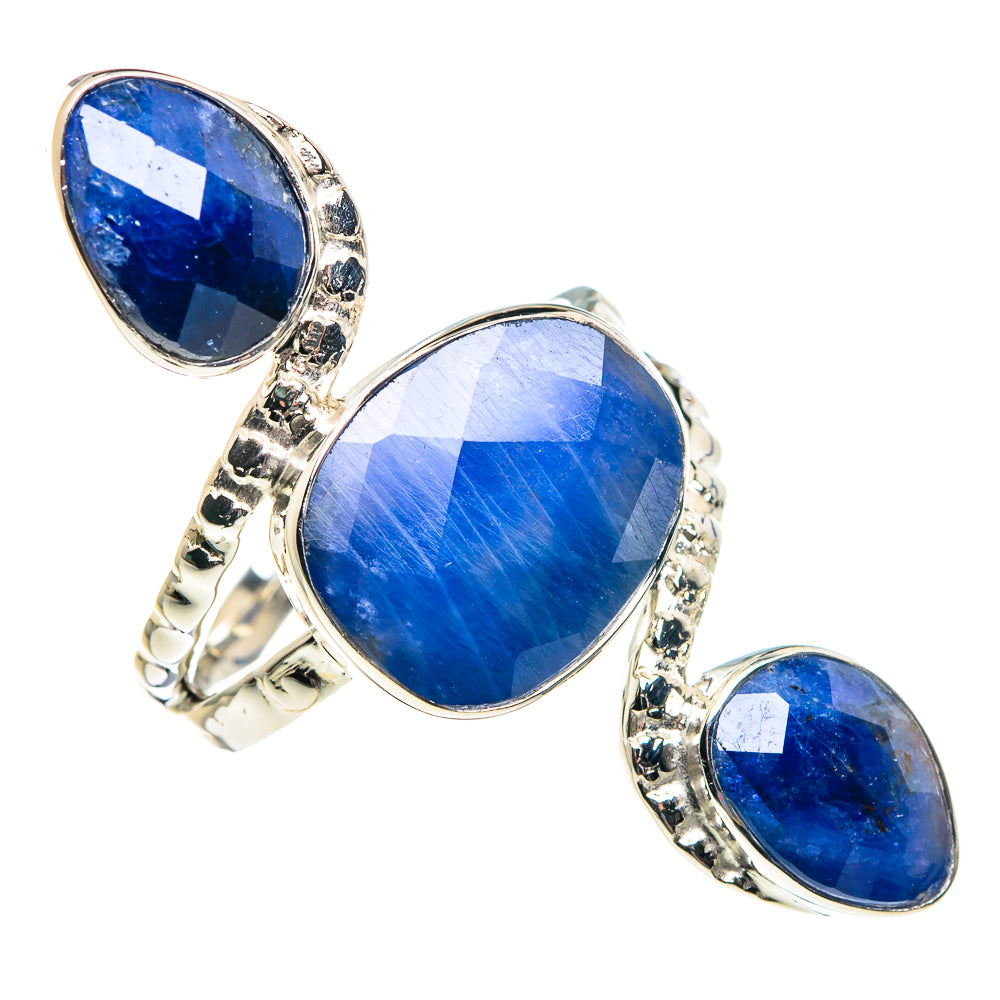 Sterling silver ring with three faceted oval blue gemstones in a scalloped bezel