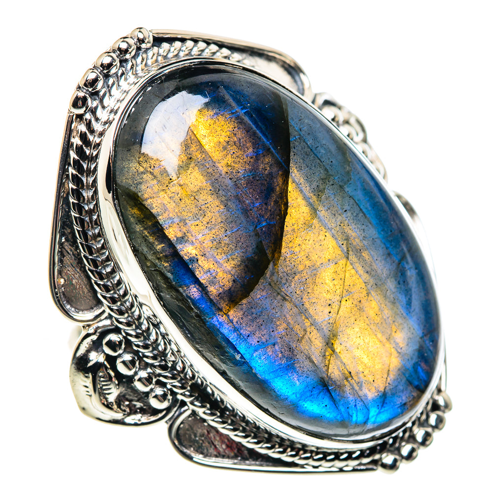 Oval labradorite sterling silver ring with blue and gold iridescent glow, ornate setting