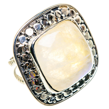 Sterling silver ring with oval opalescent moonstone and ornate bezel setting