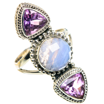 Sterling silver ring with large faceted purple teardrop, oval blue center, and matching purple