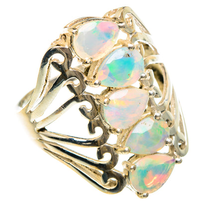 Sterling silver opal ring with four large oval opal stones and swirling filigree band