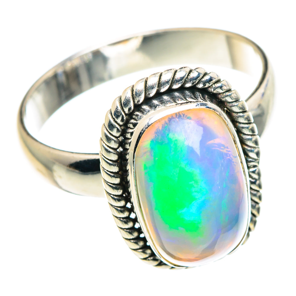 Sterling silver oval opal ring with braided bezel, bright green-blue flash
