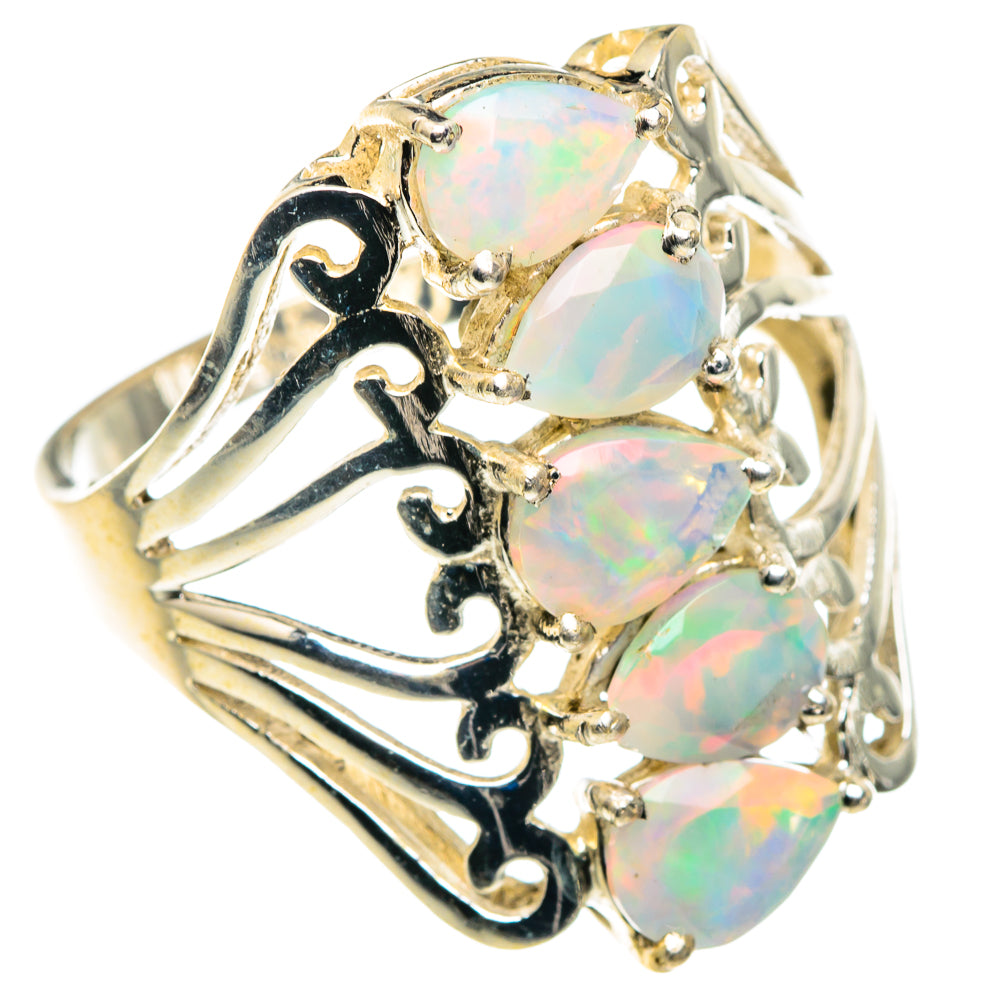 Opal ring, sterling silver with three faceted opal stones and ornate cutout band