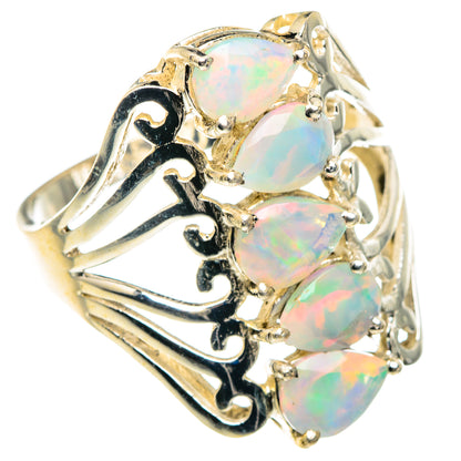 Opal ring, sterling silver with three faceted opal stones and ornate cutout band