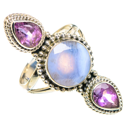 Sterling silver ring with pale blue oval cabochon and two purple teardrop stones