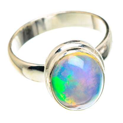 Sterling silver opal ring with round iridescent cabochon and polished band