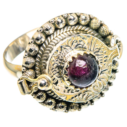 Sterling silver poison ring with large oval purple-pink tourmaline center and ornate beaded bezel