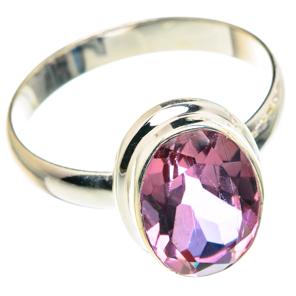 Silver ring with oval faceted pink gemstone and shiny band, size 12.5