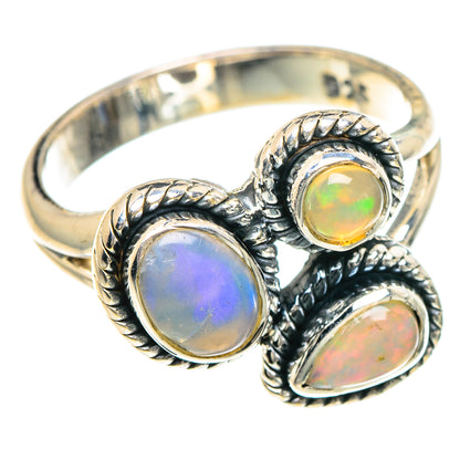 Sterling silver opal ring with three round/oval Ethiopian opal stones, ornate twisted bezel