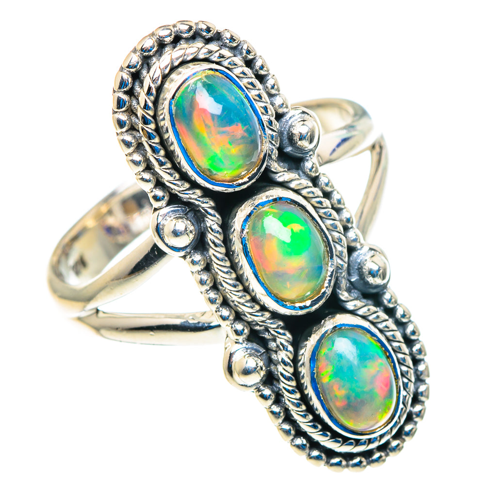 Silver opal ring with three oval Ethiopian opal cabochons, beaded halo setting