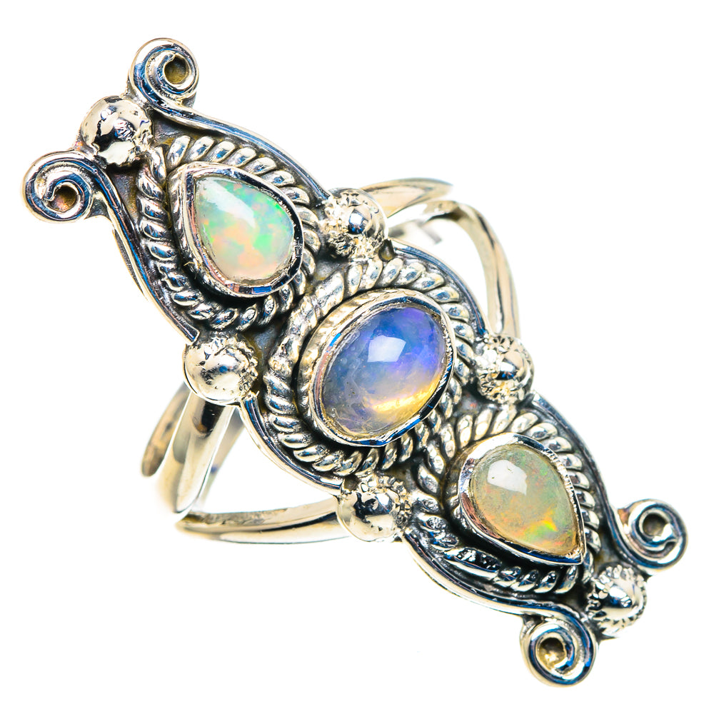 Large silver ring with three teardrop opal stones, ornate side scroll settings