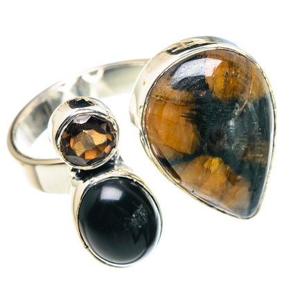 Sterling silver ring with large oval amber stone, black oval accent, and small round amber stone