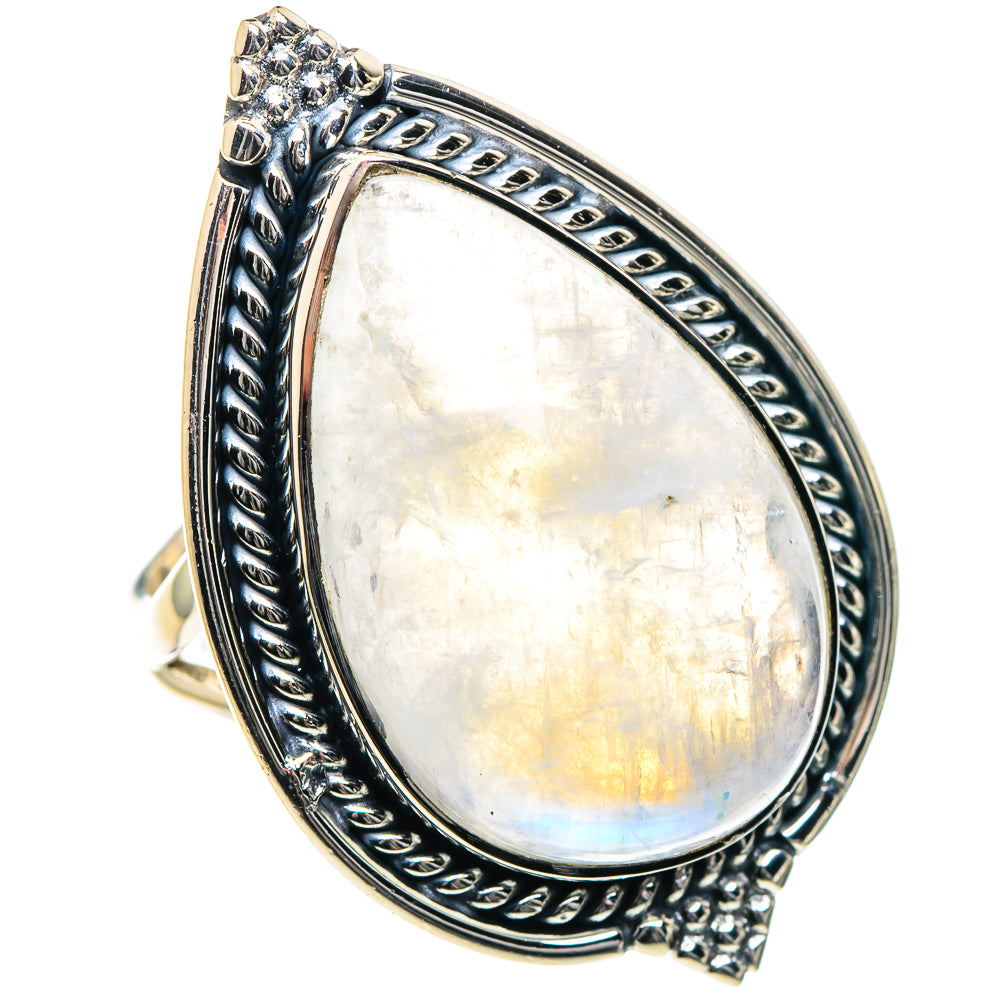 Silver teardrop moonstone ring with rainbow shimmer and engraved oval frame, side view