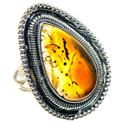 Montana agate ring, oval yellow-orange stone with black speckles, rope bead silver frame