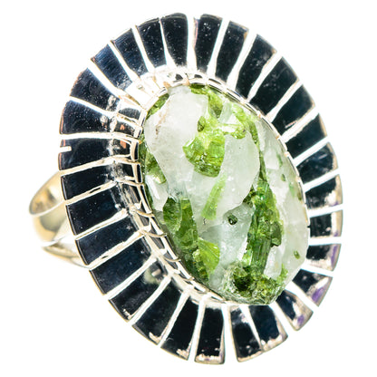 Green tourmaline in clear quartz ring, oval stone with radiating blue enamel silver setting