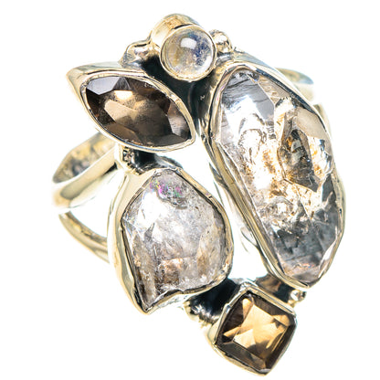 Sterling silver ring with oval and marquise faceted stones, plus round iridescent center stone