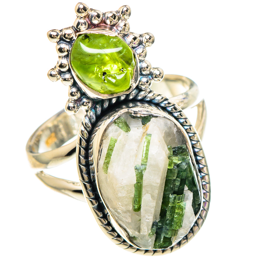 Sterling silver ring featuring a round green gemstone and an oval quartz centerpiece