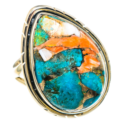 Large oval turquoise composite cabochon ring with sterling silver frame and side accents