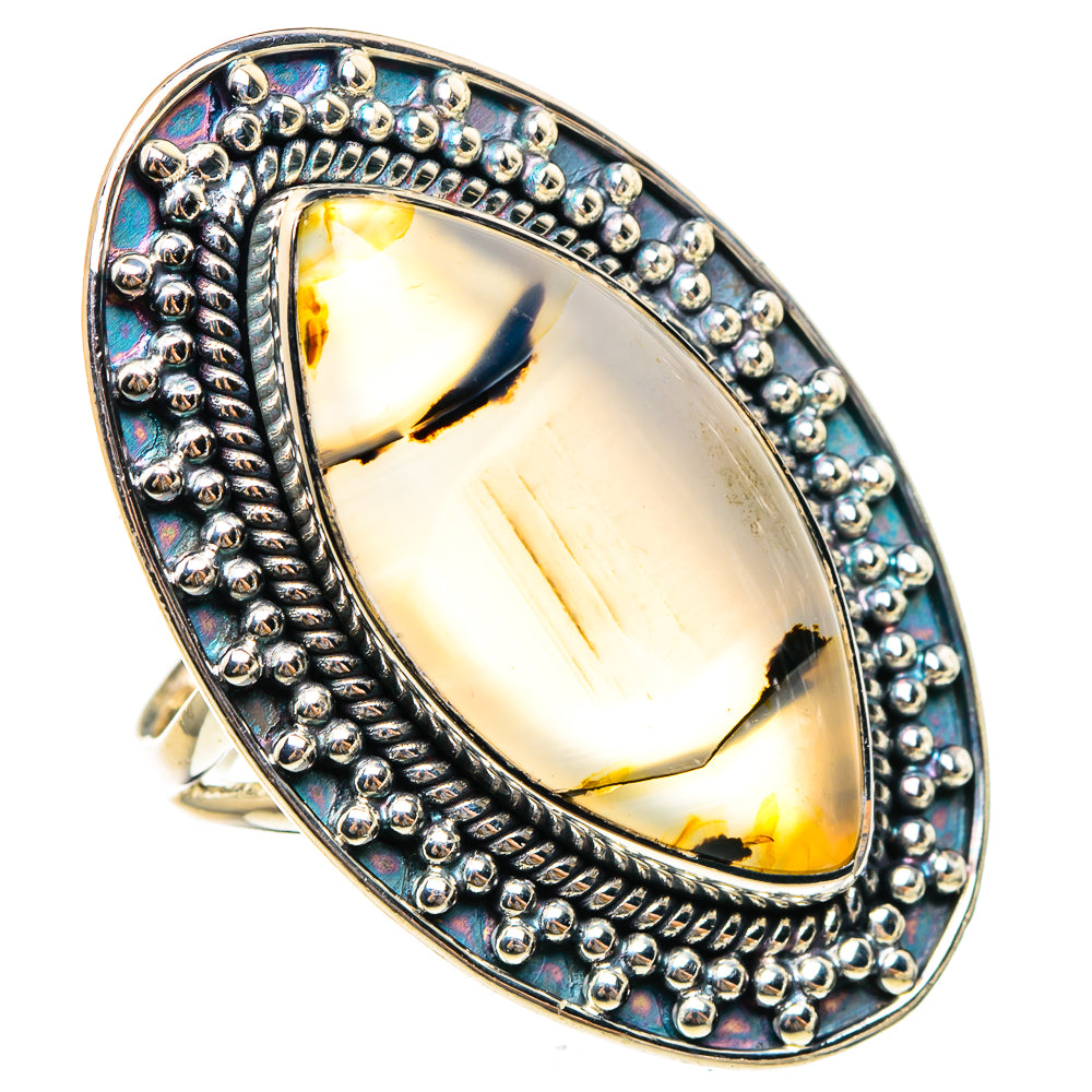 Sterling silver oval agate ring with raised bezel, bead rim, and prismatic blue