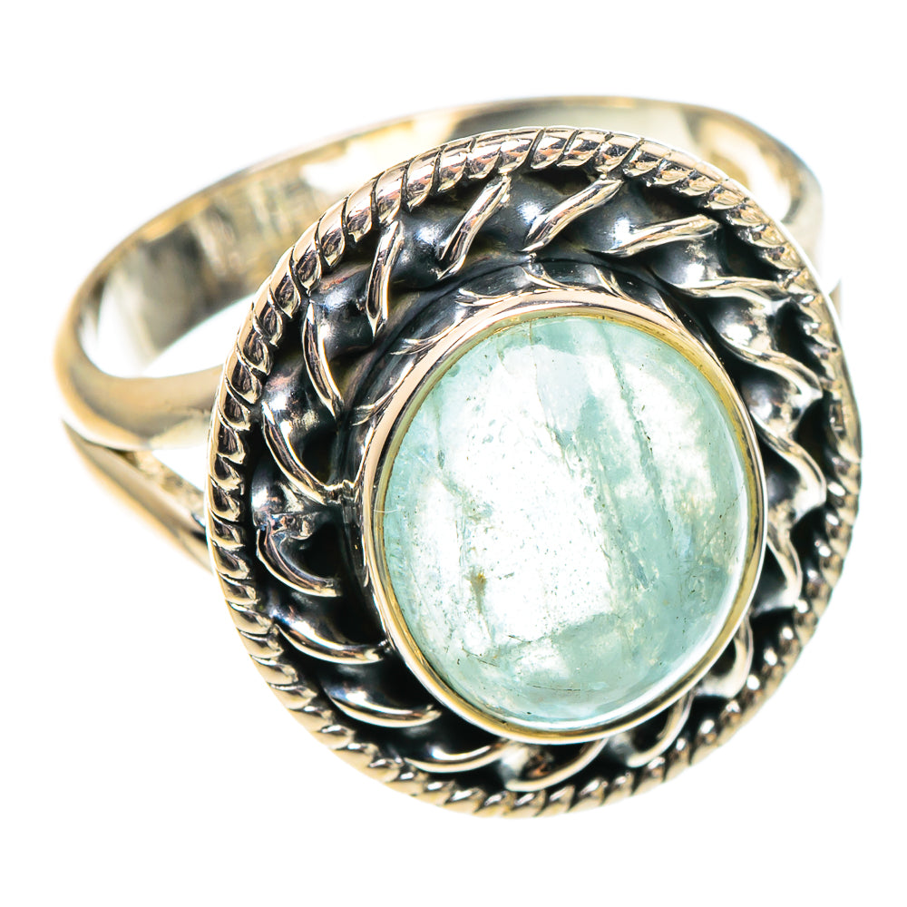 Sterling silver aquamarine ring with oval light-blue stone and ornate leaf bezel