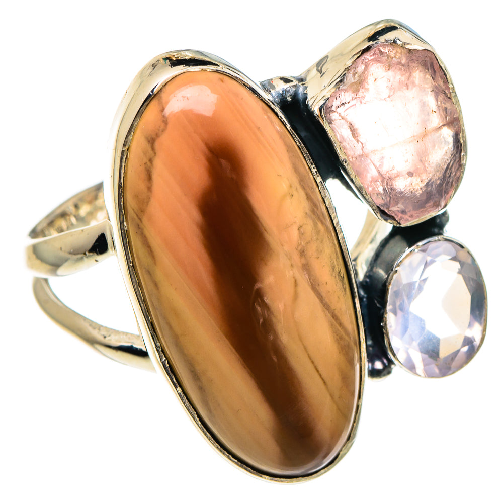 Sterling silver ring with large oval amber cabochon, pink stone, and clear quartz