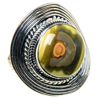 Sterling silver ring with oval yellow-green jasper cabochon and braided bezel