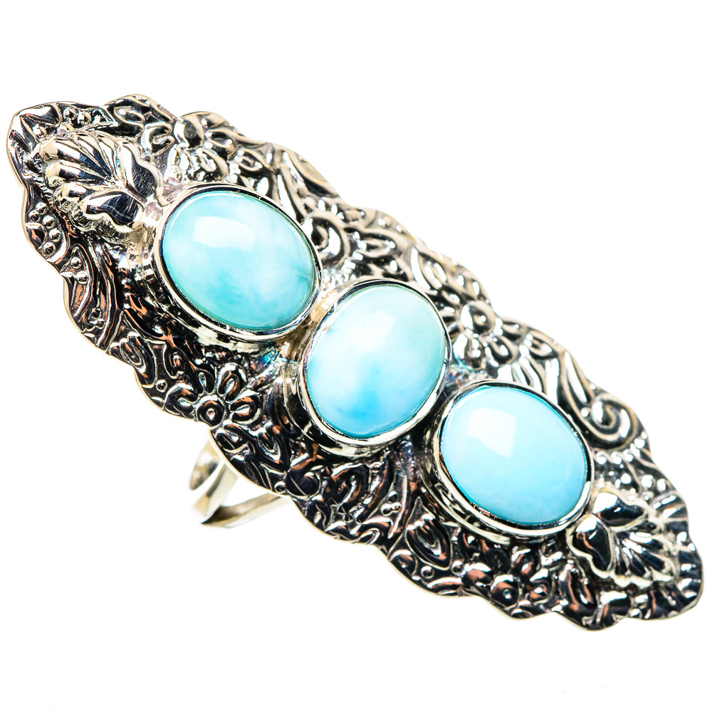 Sterling silver oval cabochon ring with three turquoise-blue stones, ornate side details